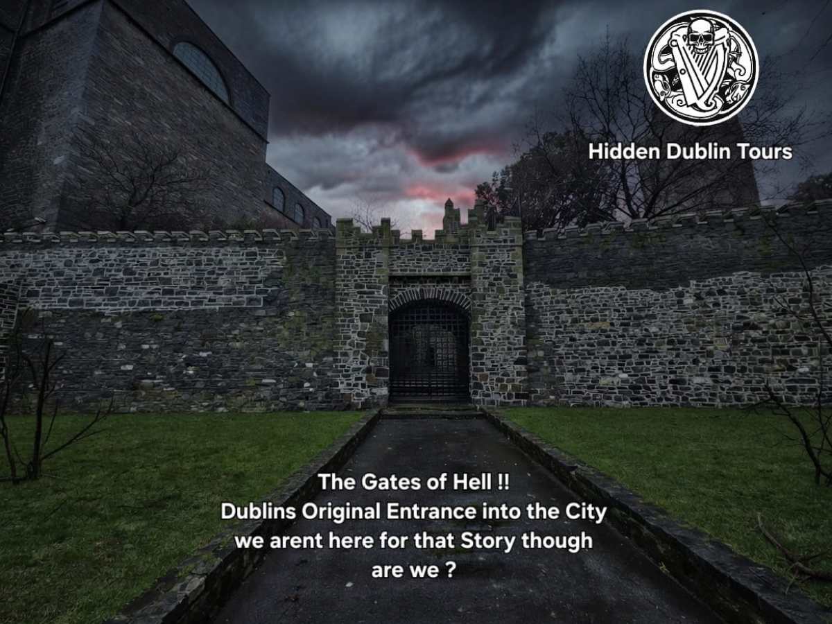 Stone archway labeled 'The Gates of Hell' with a dark, cloudy sky above.